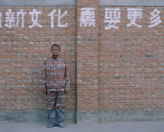 Illustration for article titled In Protest, Chinese Artist Paints Self To OctoCamo Perfection